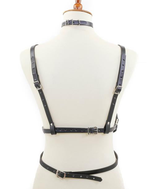 mannequin displaying black leather inverted pentagram shaped eight strap body harness with attached choker and multiple silver o rings