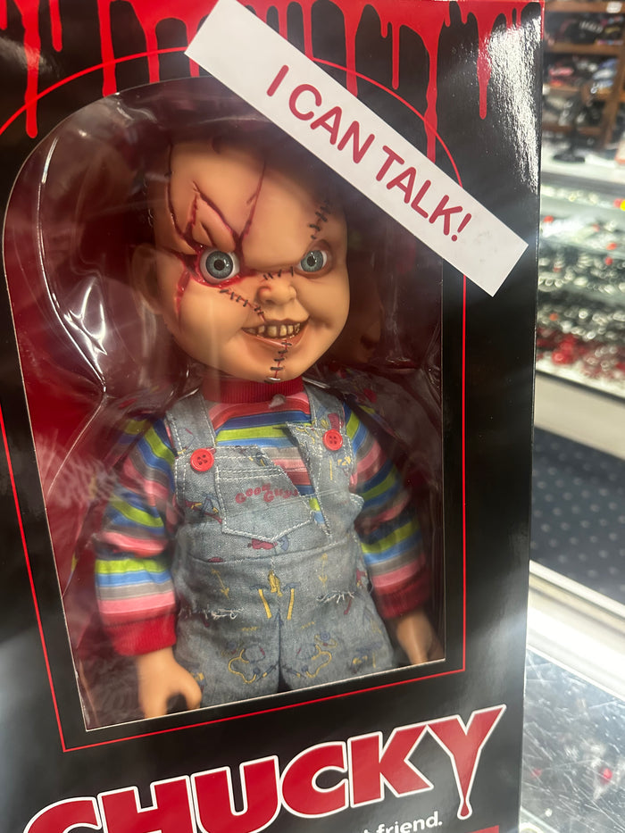 Chucky doll in packaging with 'I can talk!' label