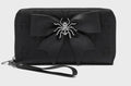Black wallet with a spider design on a light gray background