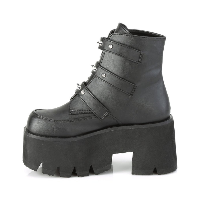 left side view black unisex vegan leather chunky 3.5 inch heel ankle boot, with three straps, bat buckles and silver tree spikes across straps