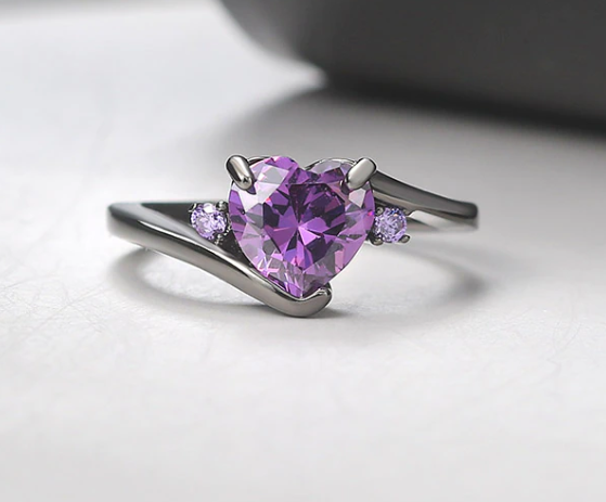 Black band with purple cubic zirconia heart.