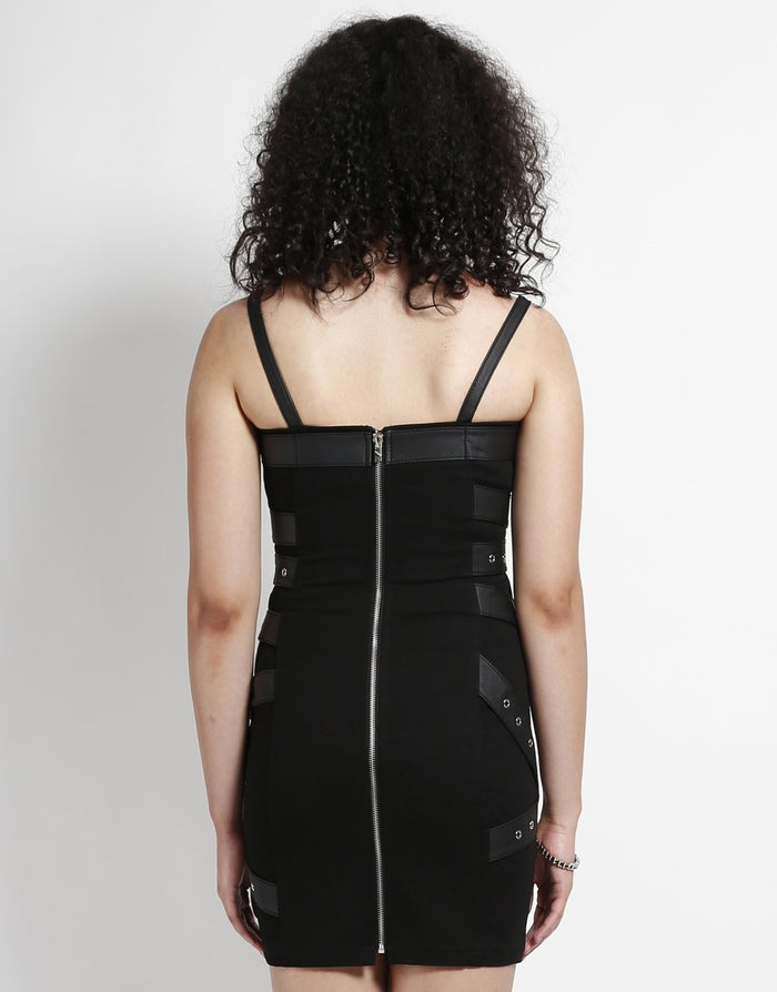back of Short black dress with adjustable straps and bondage belt details all over the front and back of the dress.