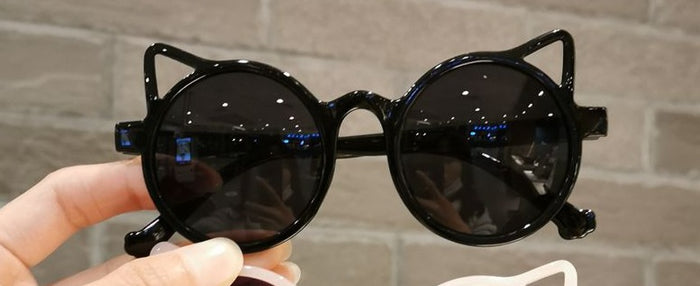 model holding glasses