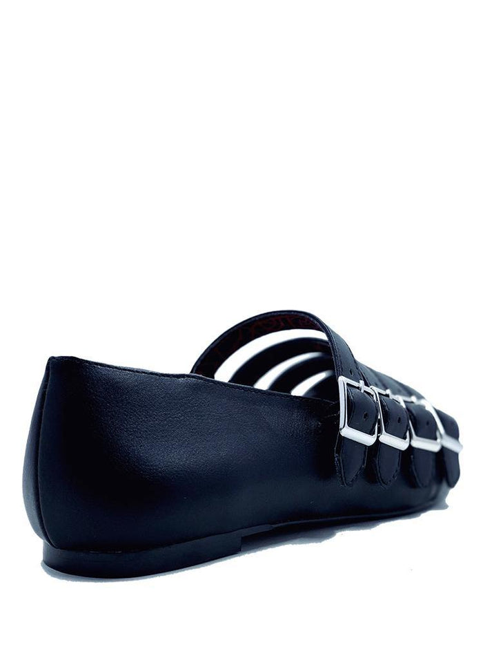 back of Black pointed toe shoe with four straps over the top with silver buckle details. Shoes are 100% vegan with a rubber outsole.