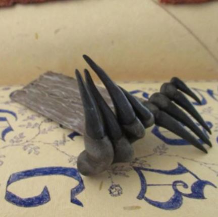 Black devil's claw hands bookmark