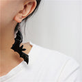 model wearing earring