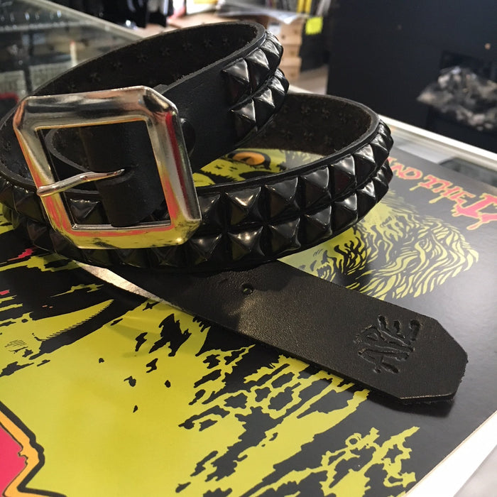 black leather belt with two rows of black pyramid studs