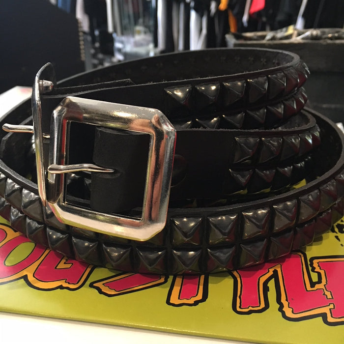 black leather belt with two rows of black pyramid studs