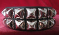 black leather bracelet with two rows of silver pyramid studs