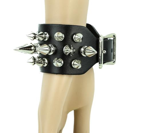 Black leather bracelet with three rows of silver spikes. Top and bottom row consist of 1/2" silver spikes. Center row consists of 1" silver spikes.
