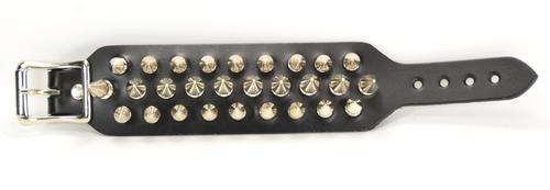 Black leather bracelet with three rows of silver spikes. Top and bottom row consist of 1/2" silver spikes. Center row consists of 1" silver spikes.