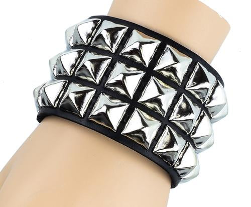 Black leather bracelet with three rows of silver pyramid studs.