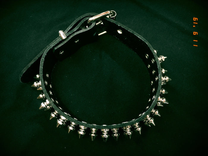 Black leather collar with three rows of silver 1/2" tree spikes.