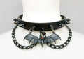 Black leather collar with 1/2" black spikes, black hanging chain, and black bat with red eyes hanging from the front center.