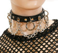 Black leather collar with silver hanging O rings and silver hanging chain.