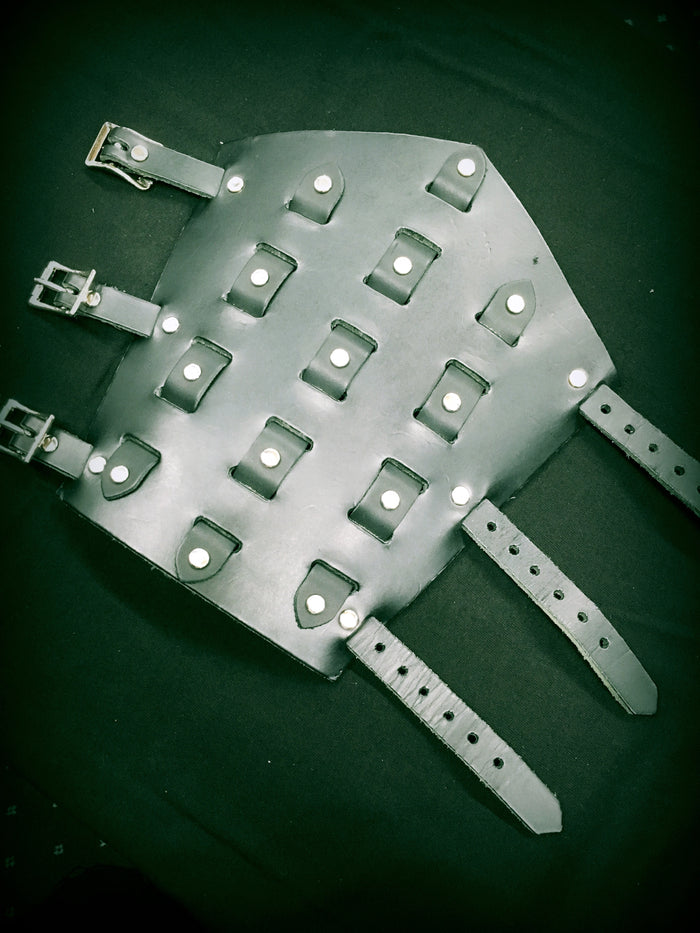 black leather gauntlet with woven leather design and three adjustable straps closure