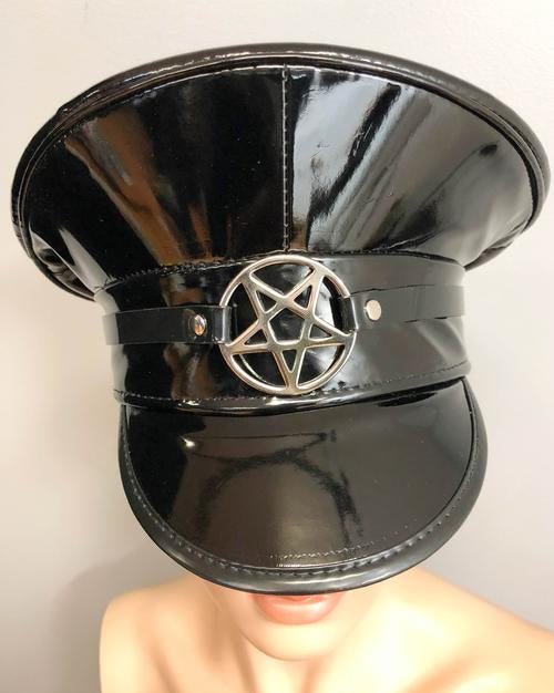 Black patent shiny leather top captain style hat. Hat has inverted silver pentagram on front center.