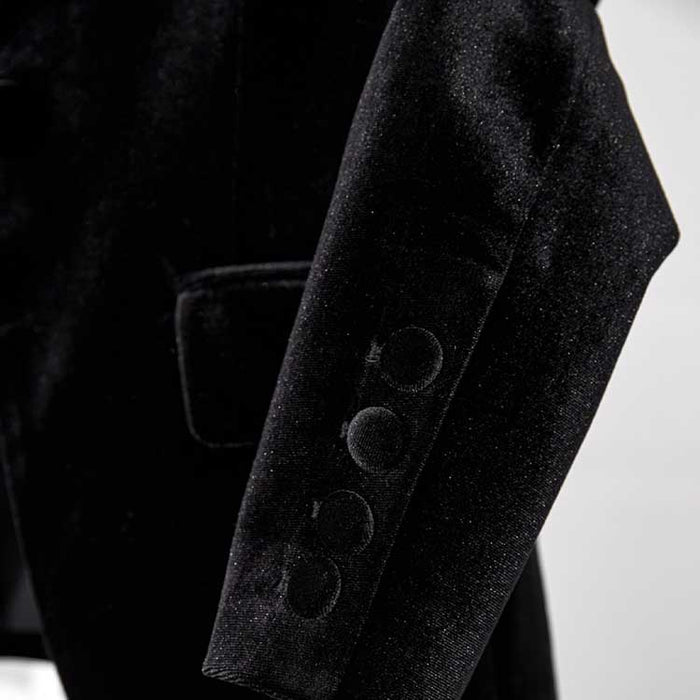 Close-up of black velvet pantsuit for women showcasing luxurious fabric and elegant design details