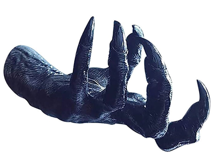 side view of Black witch hand statue