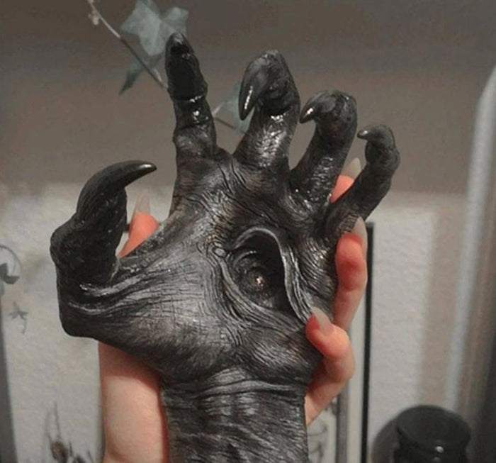 palm of Black witch hand statue with evil eyeball