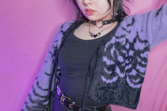 Purple cropped short cardigan with black bats design, cardigan ties closed at the front middle