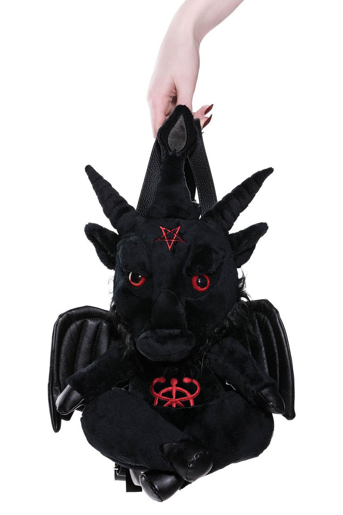 model holding backpack