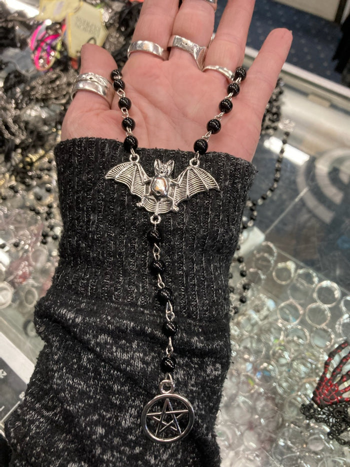 model holding necklace