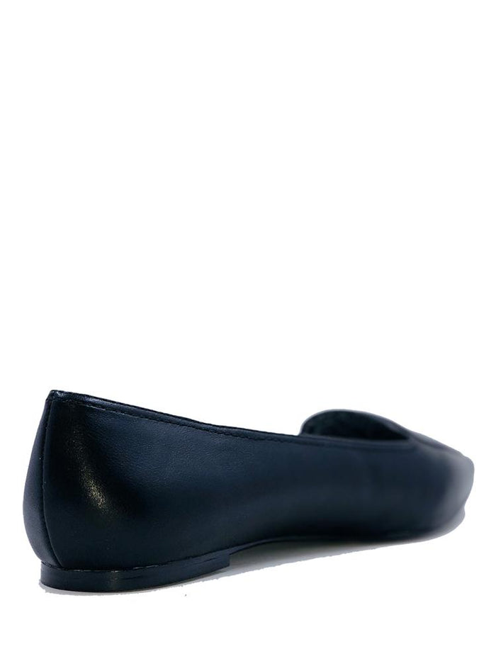 back of Black flats with pointy toe. Top of flats have silver Ouija board planchette print with red center. Inside sole of shoe is a black and white spiderweb-like pentagram print.