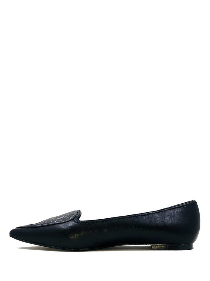 side of Black flats with pointy toe. Top of flats have silver Ouija board planchette print with red center. Inside sole of shoe is a black and white spiderweb-like pentagram print.