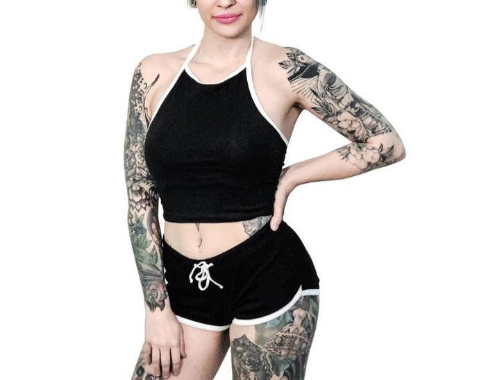 women's Black shorts with white trim and white heart designs on both buttcheeks. left heart says "fuck off" and right heart says "fuck you." with white drawstring