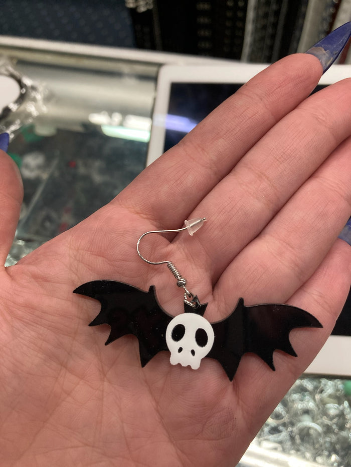 model holding earring
