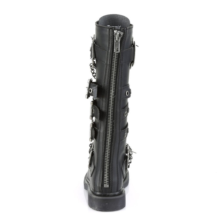 back side view of black vegan leather knee high combat boot with 1.25" heel, 20 eyelet lace-up, brass knuckle with chain on top of shoe and base of shoe with three adjustable straps in the middle, full zipper on backside