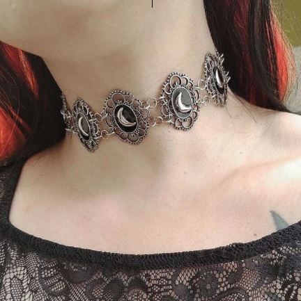 Brass colored multi crescent moon repeat pattern choker.