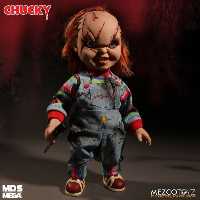 Chucky doll with red hair and striped shirt holding a knife, Mezco Toyz brand visible