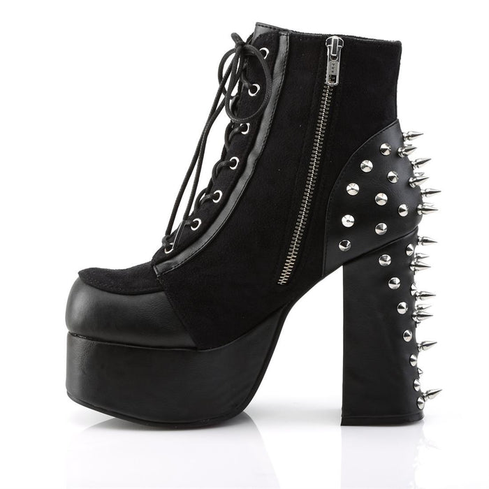 left side view of black vegan leather with suede panels 4.5 inch heel ankle boot with three O ring designs with spike in middle on each side of boot, tree spikes and s tuds on the back and 7 eyelet lace-up front with full left side zipper