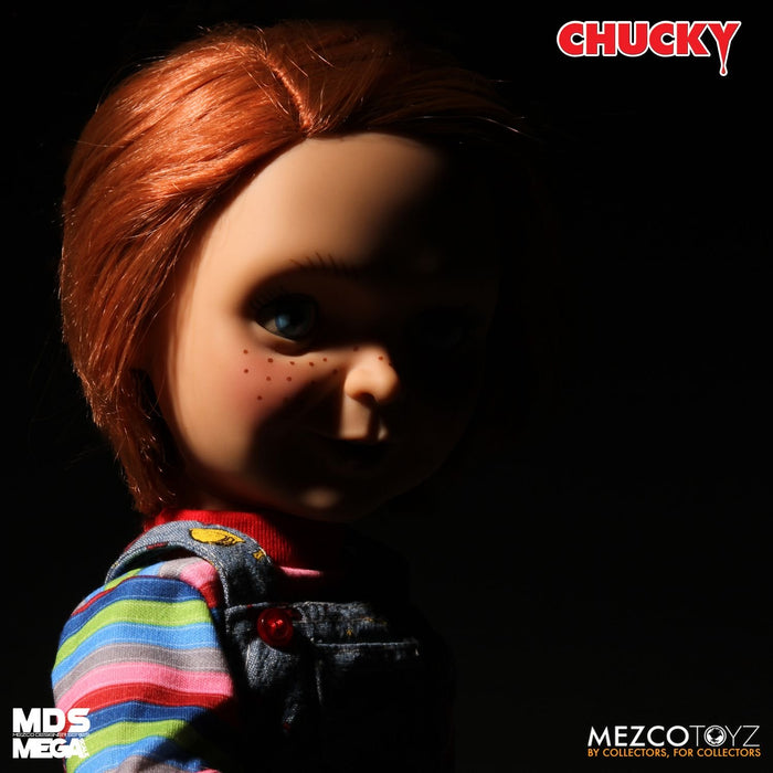 Chucky good guy doll with classic striped shirt and overalls.