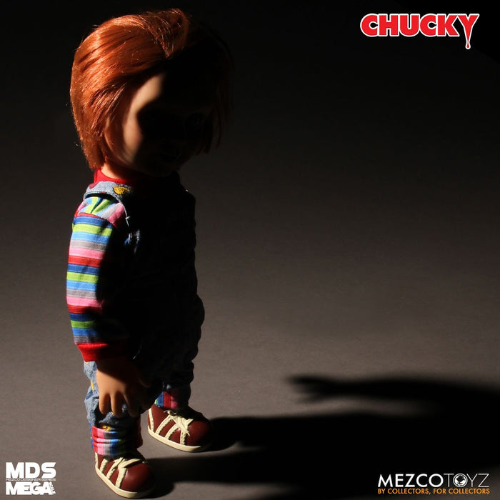 Chucky good guy doll with classic striped shirt and overalls.