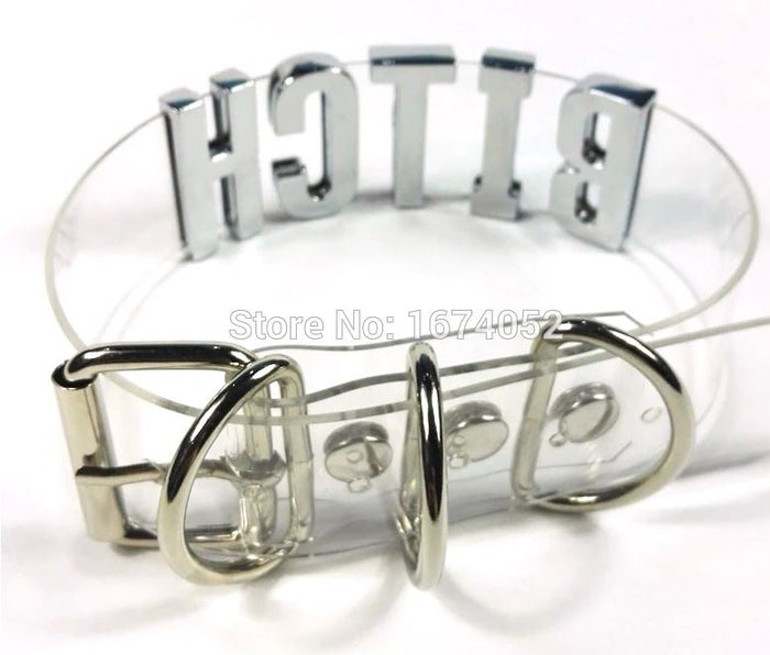back of Clear PVC collar with silver letters on the front center spelling "BITCH". Collar has adjustable belt closure on the back.
