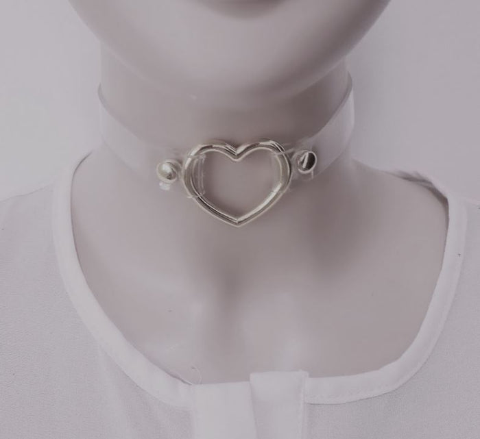 front view of Clear pvc choker with Metal heart at front center and Adjustable buckle closure on back