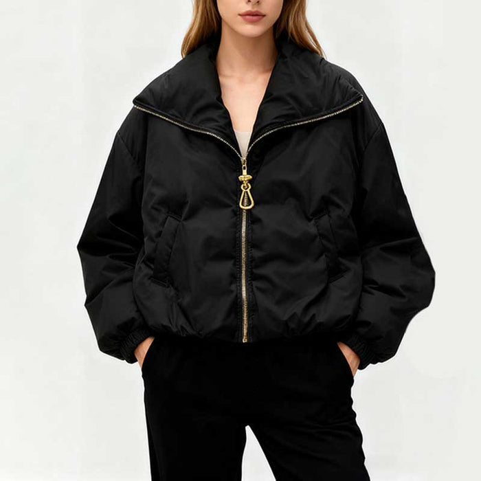 Stylish black cotton padded winter jacket for women with a zip front and oversized fit