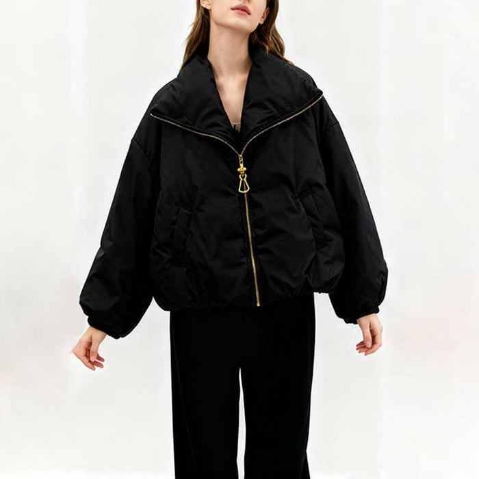 Stylish black cotton padded winter jacket for women with a zippered front and oversized silhouette
