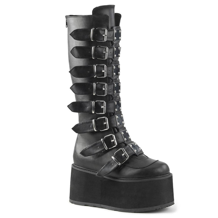 right side view of black vegan leather 3.5" platform knee high boot. Features 8 buckle straps w/ metal plates at center with back metal zip closure