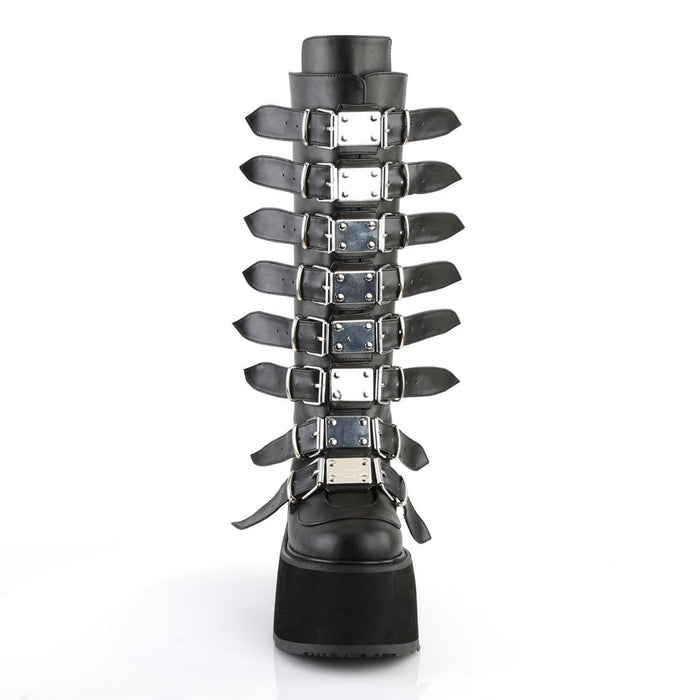 front side view of black vegan leather 3.5" platform knee high boot. Features 8 buckle straps w/ metal plates at center with back metal zip closure