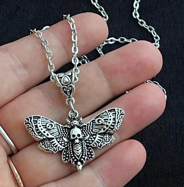 model holding necklace