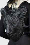 Black leather backpack with goat head design worn by a model