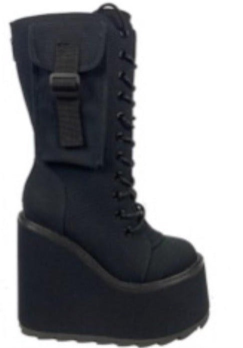 outer view of Women's black canvas mid-calf platform boot. Full lace up front, with full back zipper. Outside of boot has small pocket with strap.
