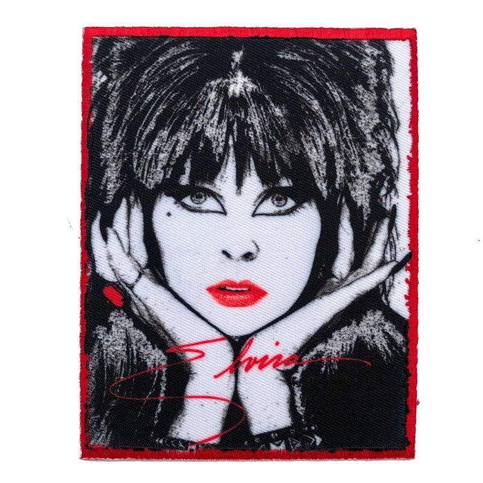 elvira patch with elvira hands on face graphic and elvira signature