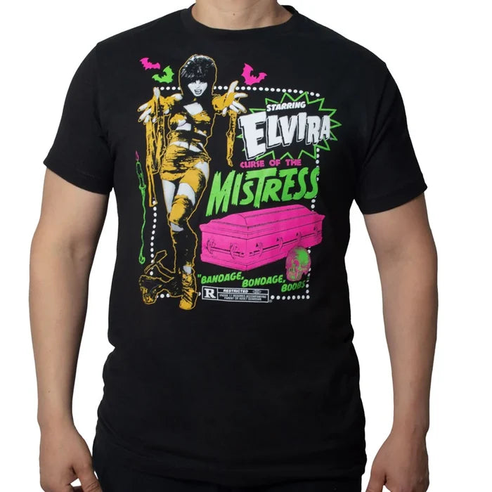 Model wearing black t-shirt with colorful graphic design featuring 'Elvira, Curse of the Mistress' on a white background.