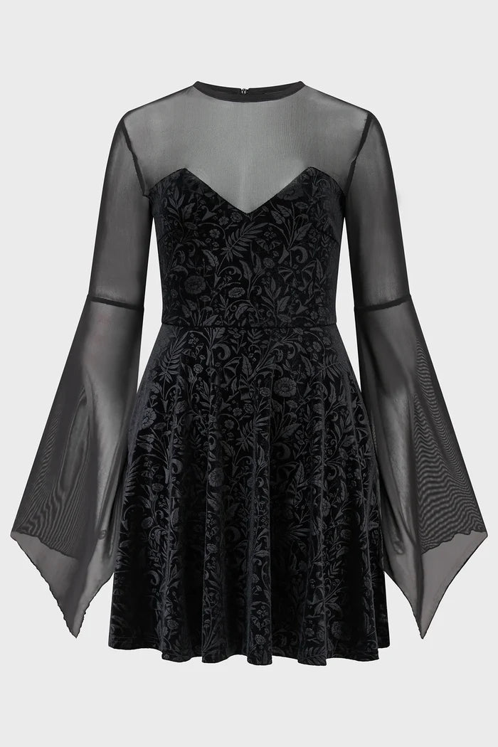 Black dress with sheer sleeves and a black hat on a white background