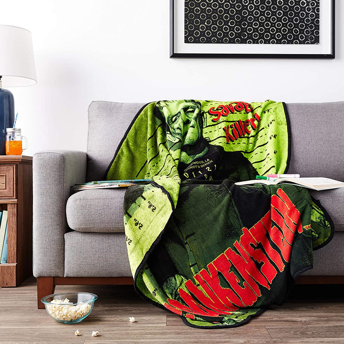 Micro plush fleece throw blanket features the iconic Frankenstein in a mug shot with green background; mirror image on back. Durable stitched-finished edge.